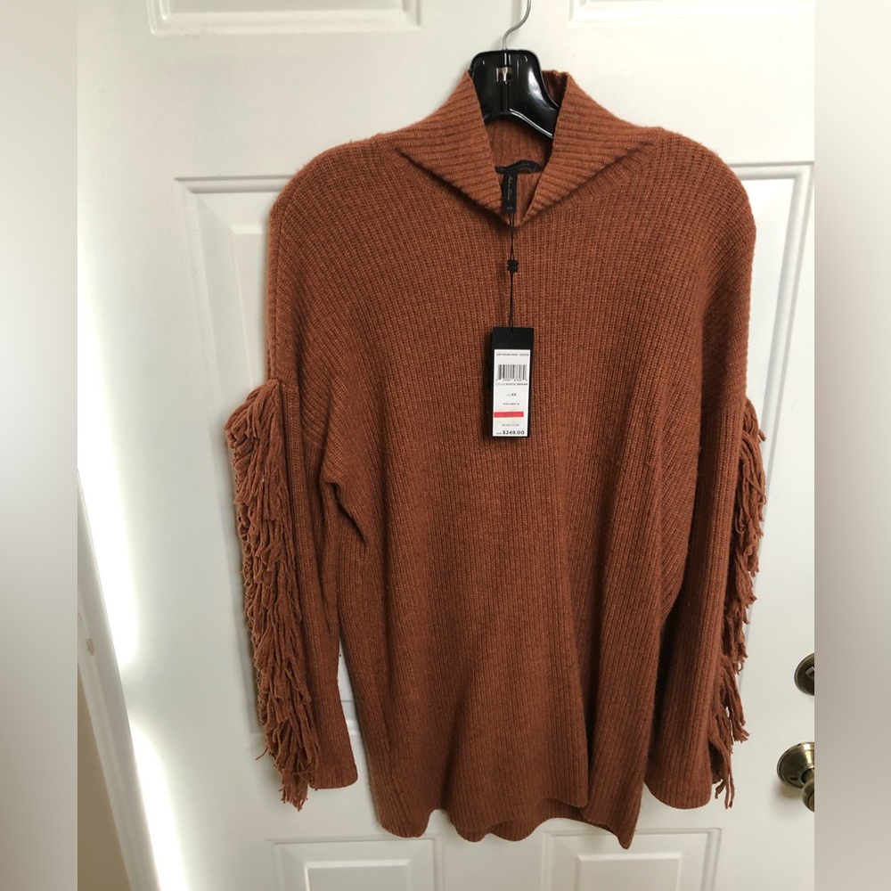 NWT. BCBG sweater. Color:Rustic Brown. Cool sweater with fringe on the sleeves.